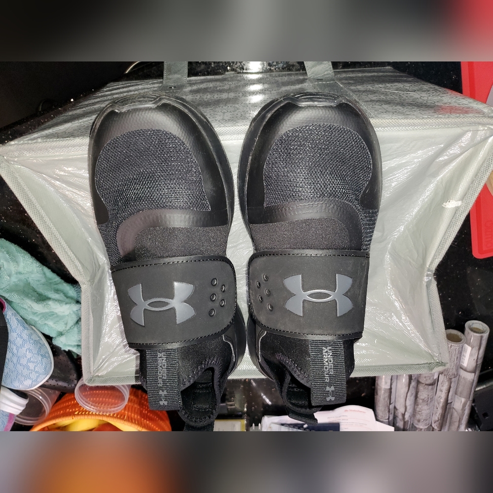 U Der Armour black slip on, size 8.5
